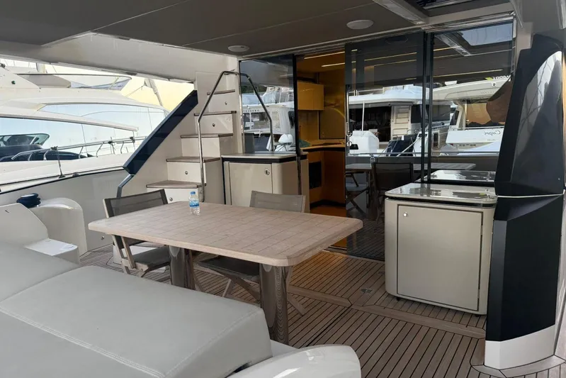 3775 Yacht Photos Pics Luxurious 2019 Absolute 62 Fly yacht interior with dining area and modern amenities.
