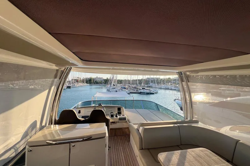 3775 Yacht Photos Pics Luxurious interior of a 2019 Absolute 62 Fly yacht with marina view.