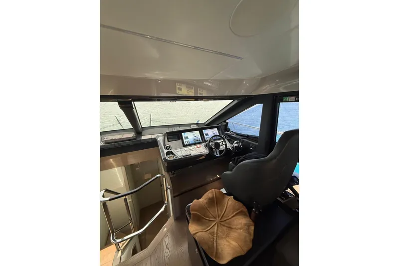 3775 Yacht Photos Pics Interior helm of 2019 Absolute 62 Fly yacht with modern navigation controls.