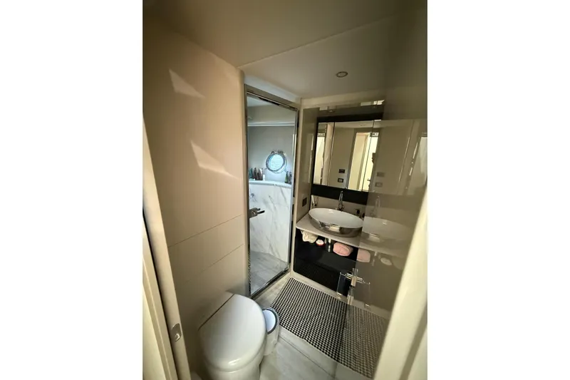 3775 Yacht Photos Pics Luxurious bathroom interior of 2019 Absolute 62 Fly yacht, featuring modern fixtures and elegant design.
