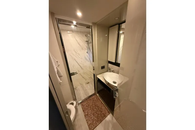 3775 Yacht Photos Pics Luxurious bathroom in 2019 Absolute 62 Fly yacht with modern fixtures and elegant design.