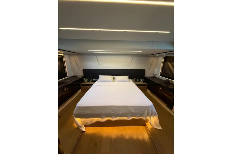 3775 Yacht Photos Pics Luxurious bedroom interior of 2019 Absolute 62 Fly yacht with modern design and ambient lighting.