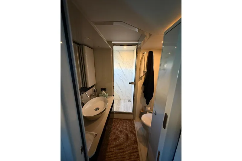 3775 Yacht Photos Pics Luxurious bathroom in 2019 Absolute 62 Fly yacht with modern fixtures and elegant design.