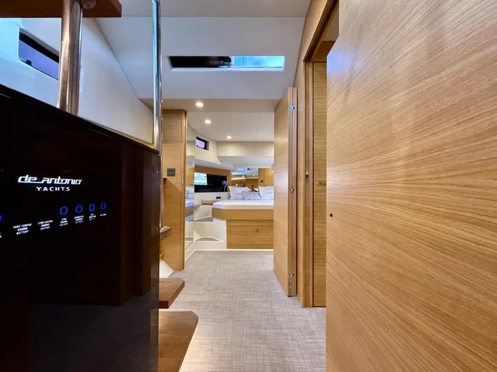  Yacht Photos Pics 2023 De Antonio Yachts D50 Coup&eacute; interior with modern wood finish and sleek design.