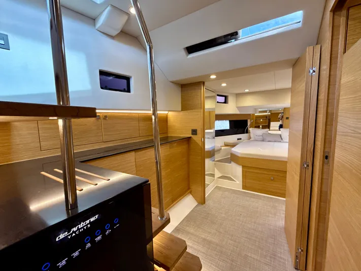  Yacht Photos Pics 2023 De Antonio Yachts D50 Coup&eacute; interior with modern wood finish and luxurious design.