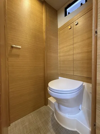  Yacht Photos Pics Luxury bathroom in 2023 De Antonio Yachts D50 Coup&eacute;, featuring modern wood paneling and sleek design.