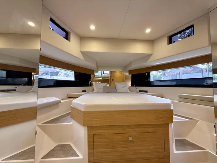  Yacht Photos Pics Luxurious interior of 2023 De Antonio Yachts D50 Coup&eacute; with modern design and cozy bedding.