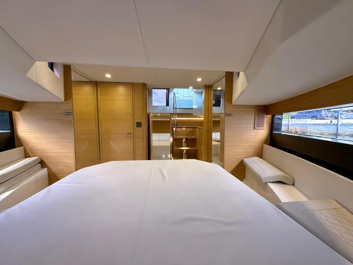  Yacht Photos Pics Luxurious interior of 2023 De Antonio Yachts D50 Coup&eacute; with modern wood finishes and ample lighting.