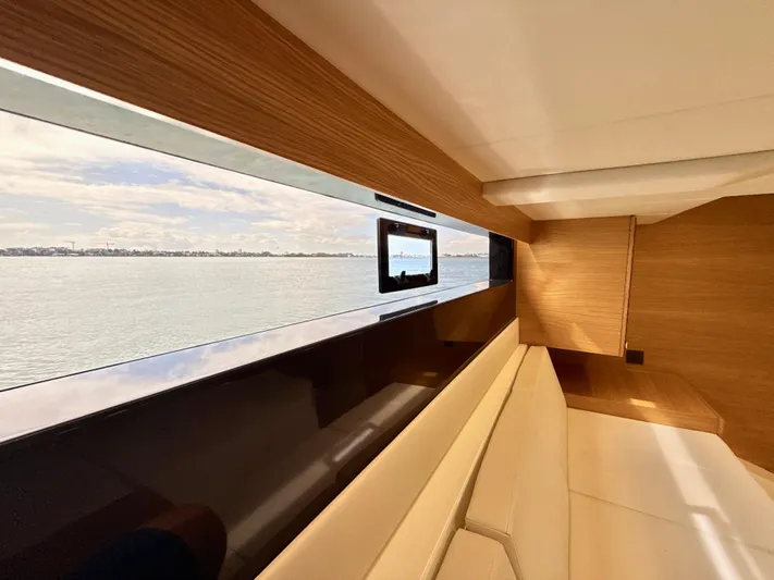 Yacht Photos Pics Interior view of 2023 De Antonio Yachts D50 Coup&eacute;, featuring sleek wood and water view.