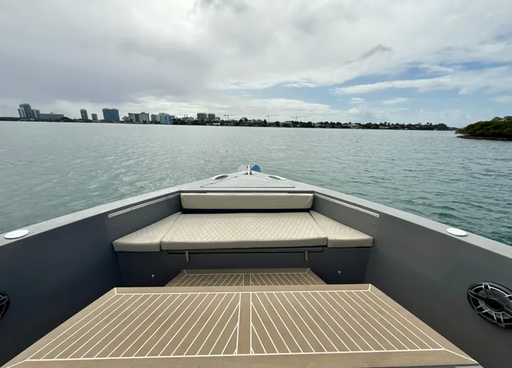  Yacht Photos Pics 2023 De Antonio Yachts D50 Coup&eacute; on calm waters, showcasing sleek deck design.