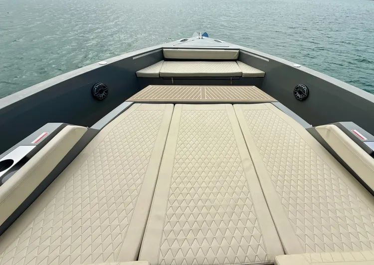  Yacht Photos Pics 2023 De Antonio Yachts D50 Coup&eacute; deck with beige cushioned seating and ocean view.