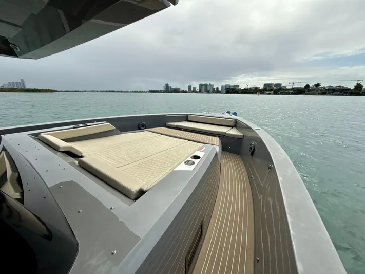  Yacht Photos Pics 2023 De Antonio Yachts D50 Coup&eacute; on water, featuring sleek deck design and modern seating.