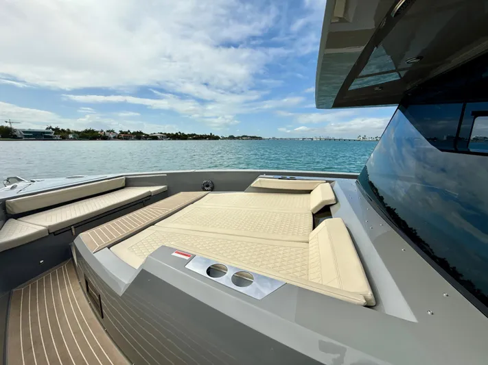  Yacht Photos Pics 2023 De Antonio Yachts D50 Coup&eacute; with spacious deck and luxurious seating, cruising on calm waters.