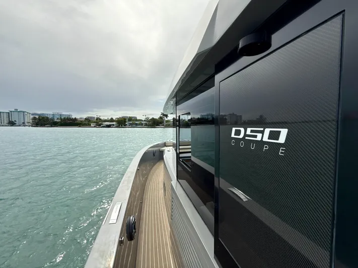  Yacht Photos Pics 2023 De Antonio Yachts D50 Coup&eacute; on water, showcasing sleek design and modern features.