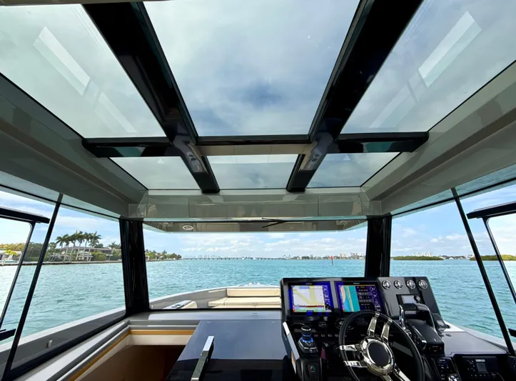  Yacht Photos Pics 2023 De Antonio Yachts D50 Coup&eacute; cockpit with panoramic glass roof and advanced navigation system.