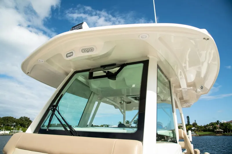  Yacht Photos Pics Sailfish 360 CC 2022 boat with modern design and blue sky background.