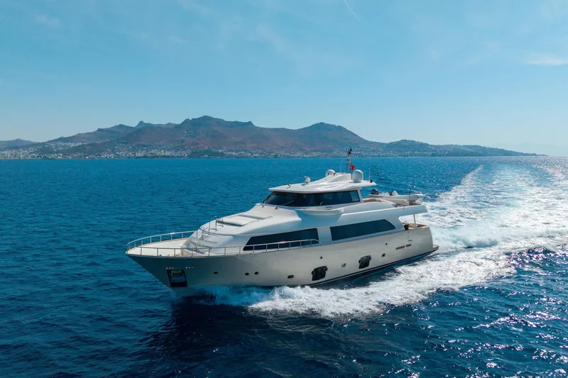 La Luce Yacht Photos Pics Luxurious 2008 Custom Line Navetta 26 yacht cruising on open sea with scenic mountain backdrop.