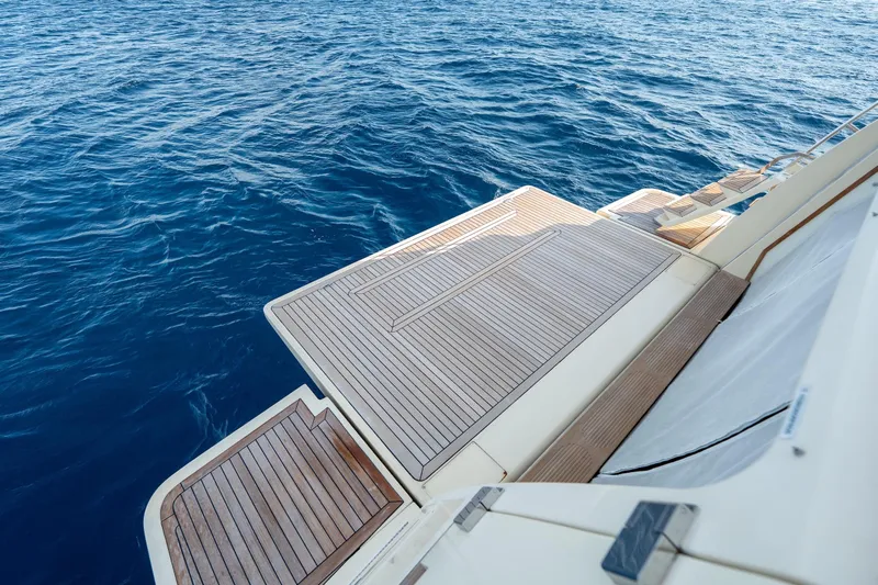 La Luce Yacht Photos Pics Luxury yacht Custom Line Navetta 26, 2008 model, with elegant wooden deck by the sea.