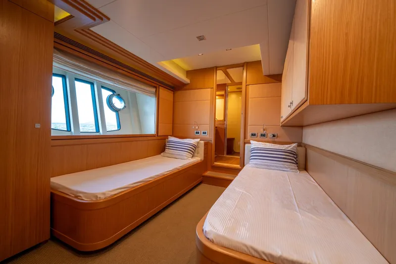 La Luce Yacht Photos Pics Luxurious twin cabin interior on 2008 Custom Line Navetta 26 yacht, featuring wooden finishes.