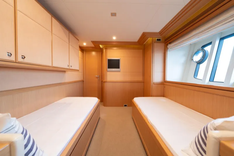 La Luce Yacht Photos Pics Luxurious twin cabin interior on 2008 Custom Line Navetta 26 yacht, featuring elegant wood finishes.