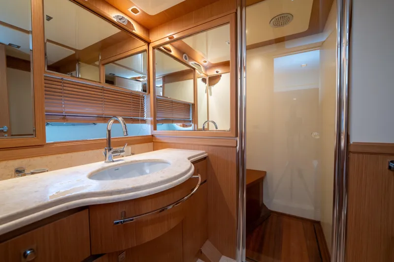 La Luce Yacht Photos Pics Luxurious bathroom interior of 2008 Custom Line Navetta 26 yacht with elegant wood finishes.