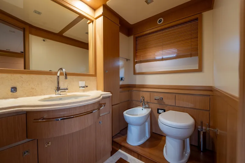 La Luce Yacht Photos Pics Luxurious bathroom in 2008 Custom Line Navetta 26 yacht, featuring elegant wood finishes.