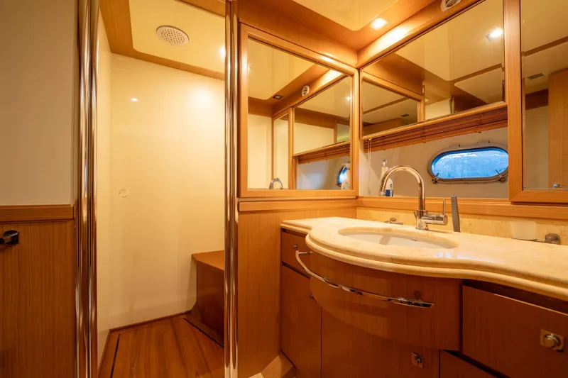 La Luce Yacht Photos Pics Luxurious bathroom interior of 2008 Custom Line Navetta 26 yacht with elegant wood finishes.