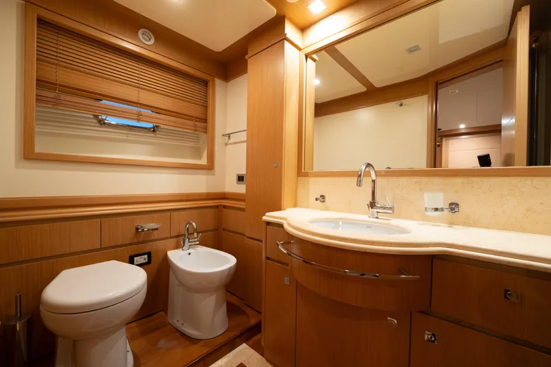 La Luce Yacht Photos Pics Luxurious bathroom in 2008 Custom Line Navetta 26 yacht with wood accents and modern fixtures.