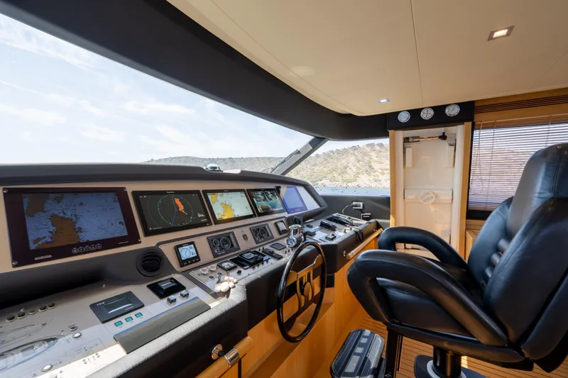 La Luce Yacht Photos Pics Cockpit of 2008 Custom Line Navetta 26 yacht with navigation screens and controls.