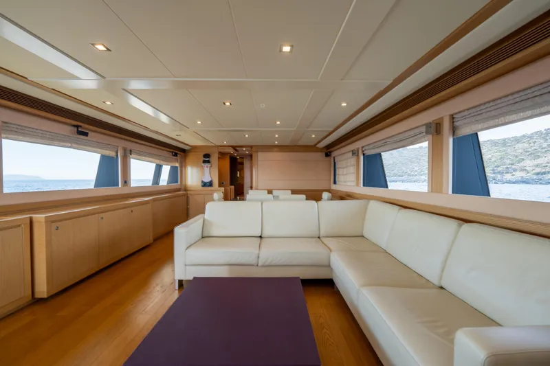 La Luce Yacht Photos Pics Luxurious interior of 2008 Custom Line Navetta 26 yacht with elegant seating and panoramic windows.