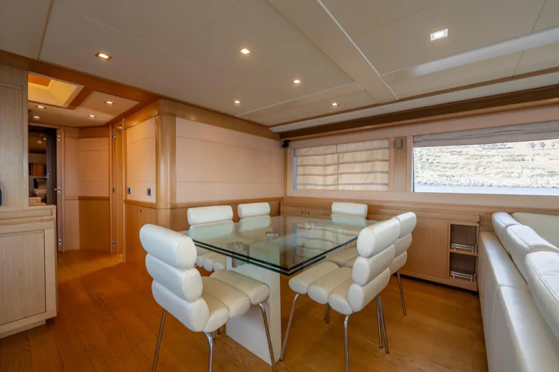 La Luce Yacht Photos Pics Luxurious interior of 2008 Custom Line Navetta 26 yacht with elegant dining area.