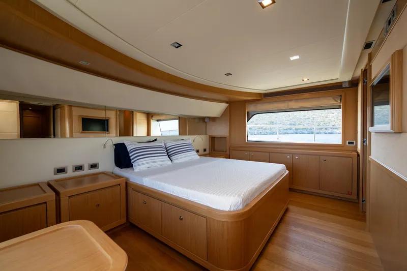La Luce Yacht Photos Pics Luxurious bedroom interior on 2008 Custom Line Navetta 26 yacht with scenic window view.