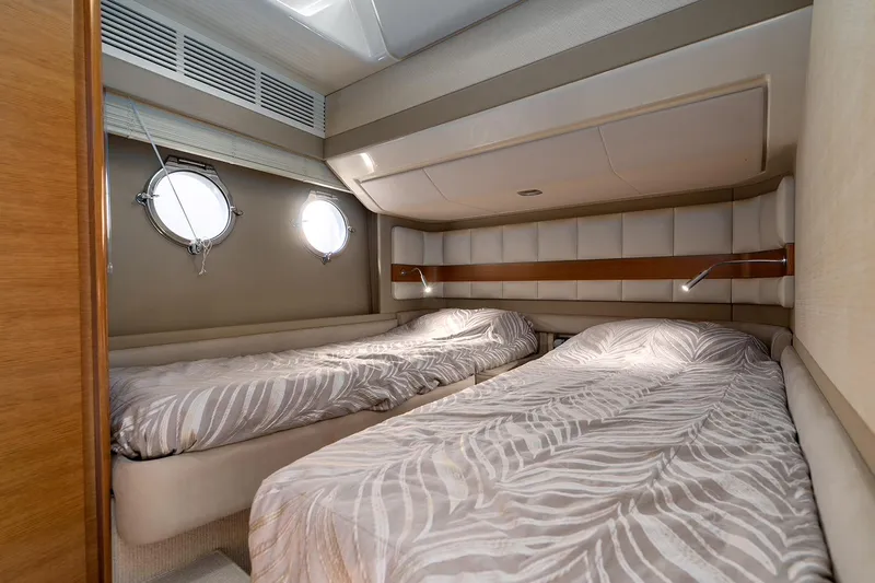 Elena I Yacht Photos Pics Luxurious twin cabin interior of 2013 Azimut 64 yacht with stylish bedding.