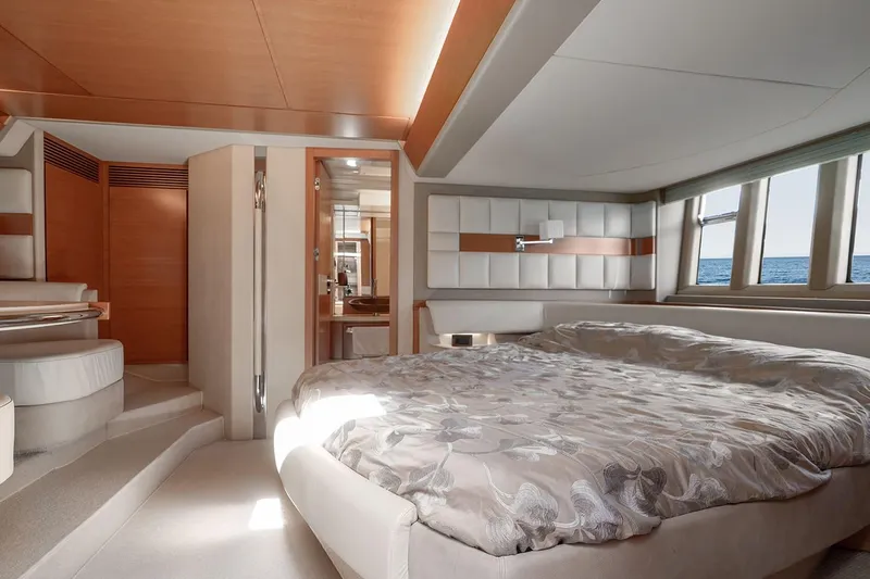 Elena I Yacht Photos Pics Luxurious bedroom interior of 2013 Azimut 64 yacht with ocean view windows.