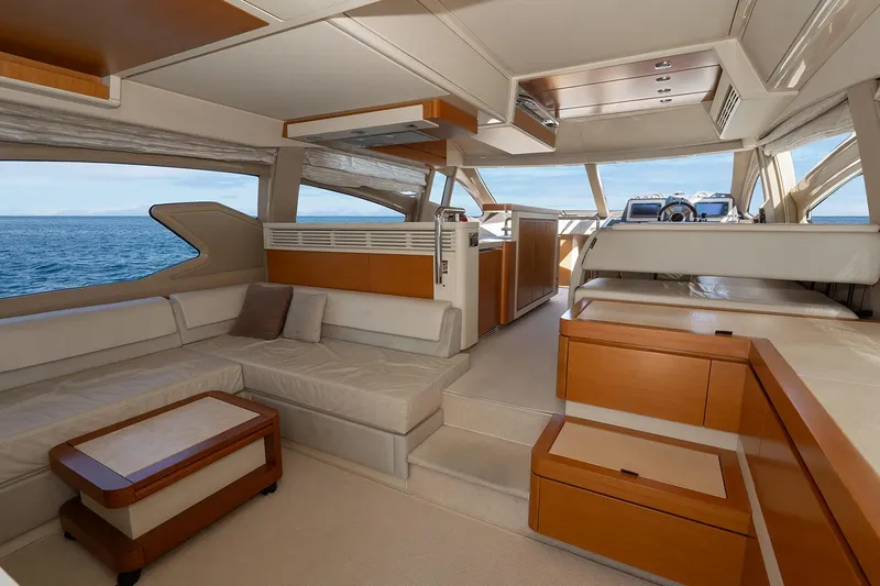 Elena I Yacht Photos Pics Luxurious interior of a 2013 Azimut 64 yacht with elegant seating and ocean view.