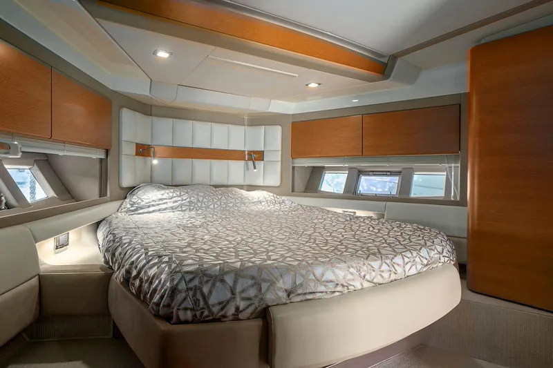 Elena I Yacht Photos Pics Luxurious bedroom interior of 2013 Azimut 64 yacht with modern design and elegant furnishings.