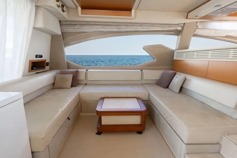 Elena I Yacht Photos Pics Luxurious interior of 2013 Azimut 64 yacht with ocean view through large windows.
