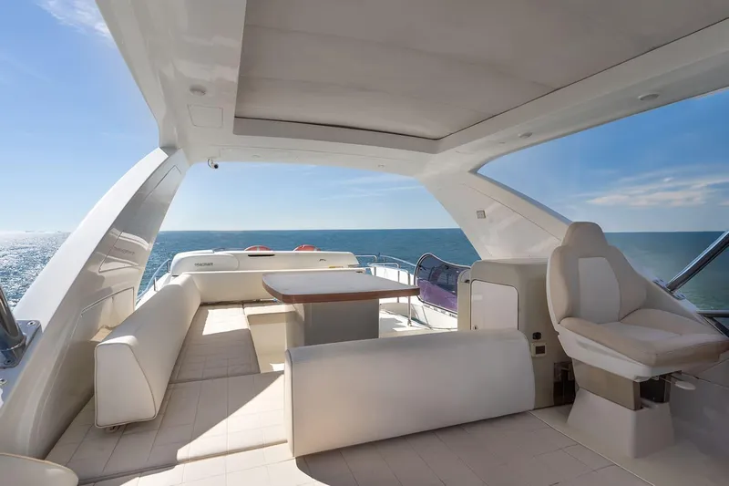 Elena I Yacht Photos Pics Luxurious 2013 Azimut 64 yacht interior with seating and ocean view.