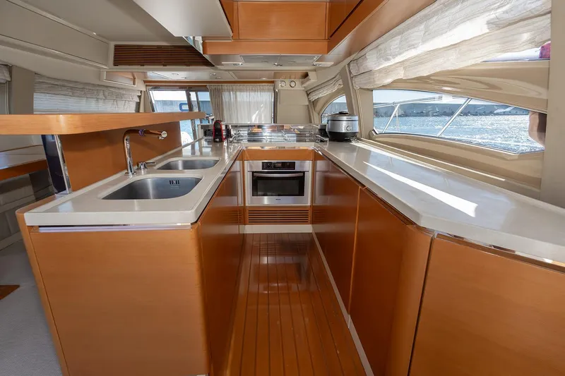Elena I Yacht Photos Pics Luxurious kitchen interior of 2013 Azimut 64 yacht with modern appliances and sleek design.