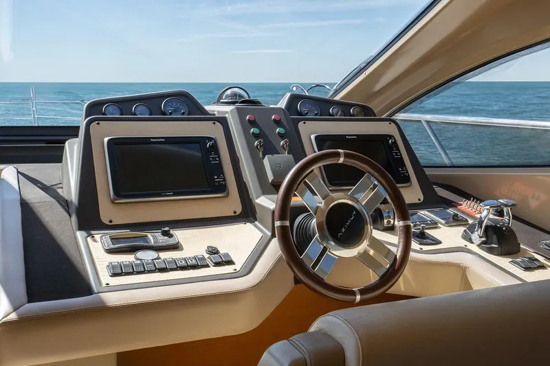 Elena I Yacht Photos Pics Helm of 2013 Azimut 64 yacht with dual displays and ocean view.