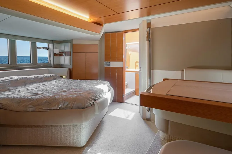 Elena I Yacht Photos Pics Luxurious bedroom interior of 2013 Azimut 64 yacht with ocean view.
