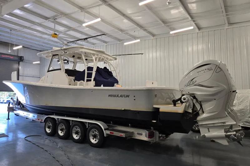  Yacht Photos Pics 2020 Regulator 41 boat in a garage, mounted on a trailer with Yamaha engines.