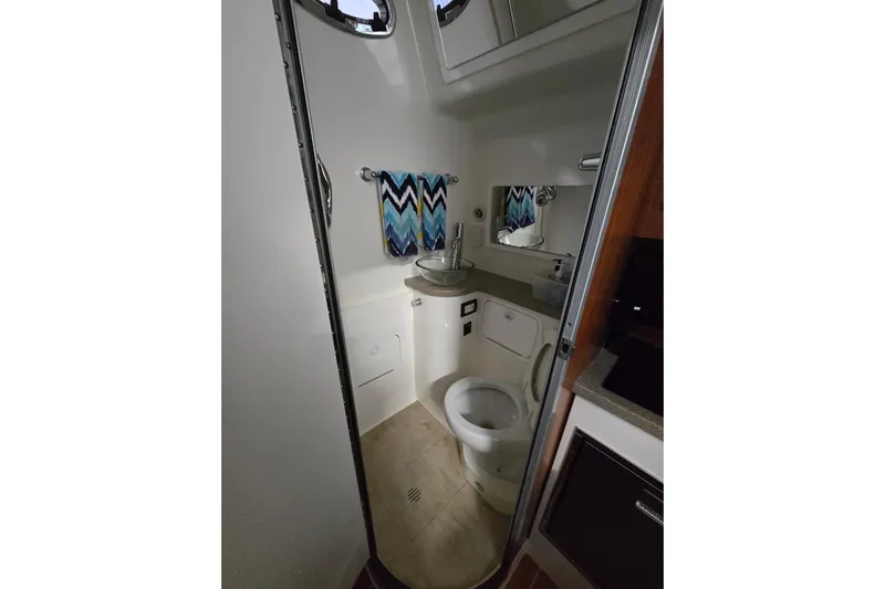  Yacht Photos Pics 2020 Regulator 41 boat bathroom with modern fixtures and chevron towel.
