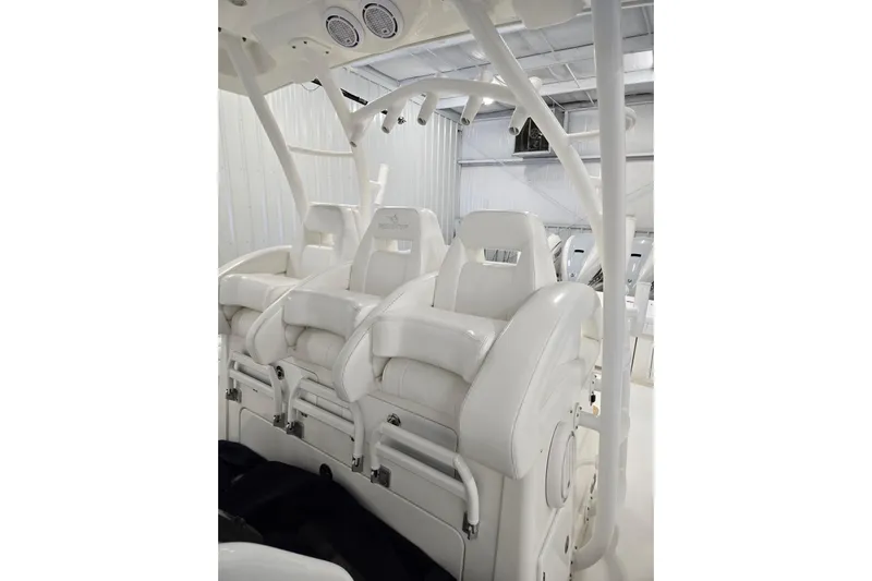  Yacht Photos Pics Luxurious white seating on a 2020 Regulator 41 boat, showcasing premium craftsmanship.
