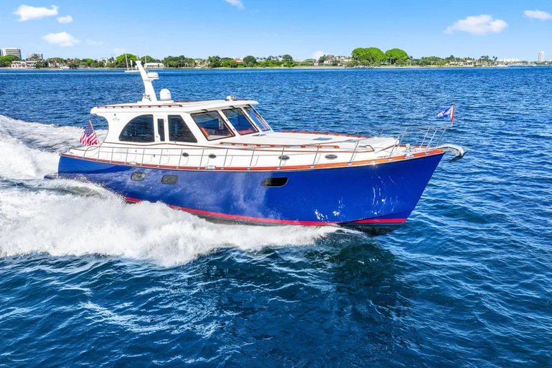 Bebe Deux Yacht Photos Pics 2023 Vicem 65 Classic yacht cruising on blue ocean waters under clear skies.