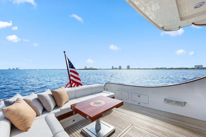 Bebe Deux Yacht Photos Pics 2023 Vicem 65 Classic yacht deck with seating, table, and ocean view.