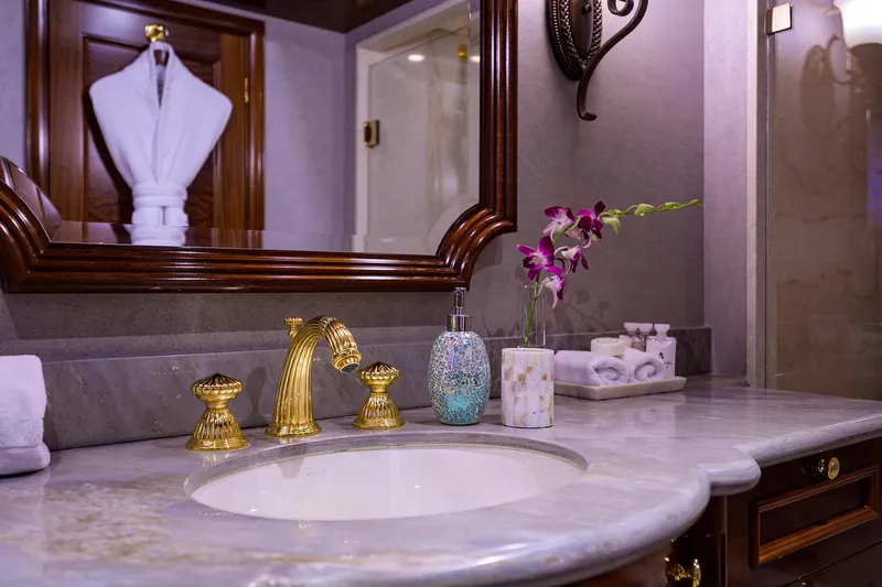 Excellence Yacht Photos Pics Luxurious yacht bathroom with marble countertop, gold fixtures, and elegant decor. Richmond Yachts 150, 2010.