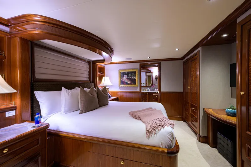 Excellence Yacht Photos Pics Luxurious bedroom interior on 2010 Richmond Yachts 150, featuring elegant wood finishes and cozy bedding.