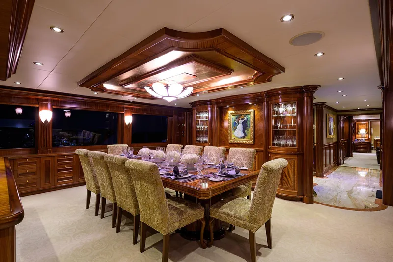 Excellence Yacht Photos Pics Luxurious dining area on 2010 Richmond Yachts 150, featuring elegant wood paneling and plush seating.