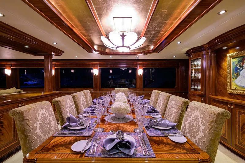 Excellence Yacht Photos Pics Luxurious dining room on 2010 Richmond Yachts 150, featuring elegant decor and fine table settings.